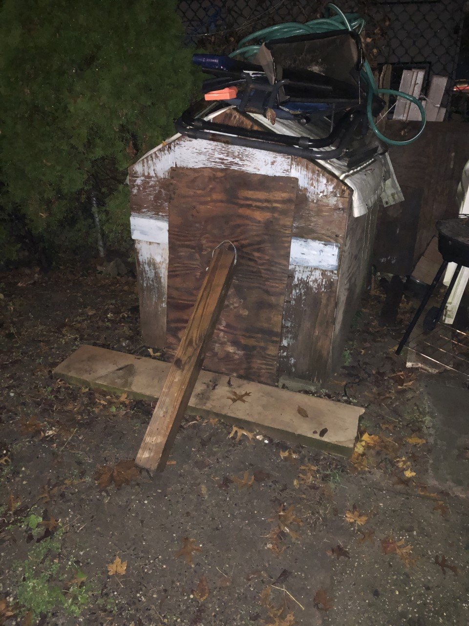 Officers discovered a dog in a doghouse in the backyard of a Glen Cove residence. The doghouse front door was blocked with plywood, there was no light, food, or water inside and the floor was littered with old feces.
